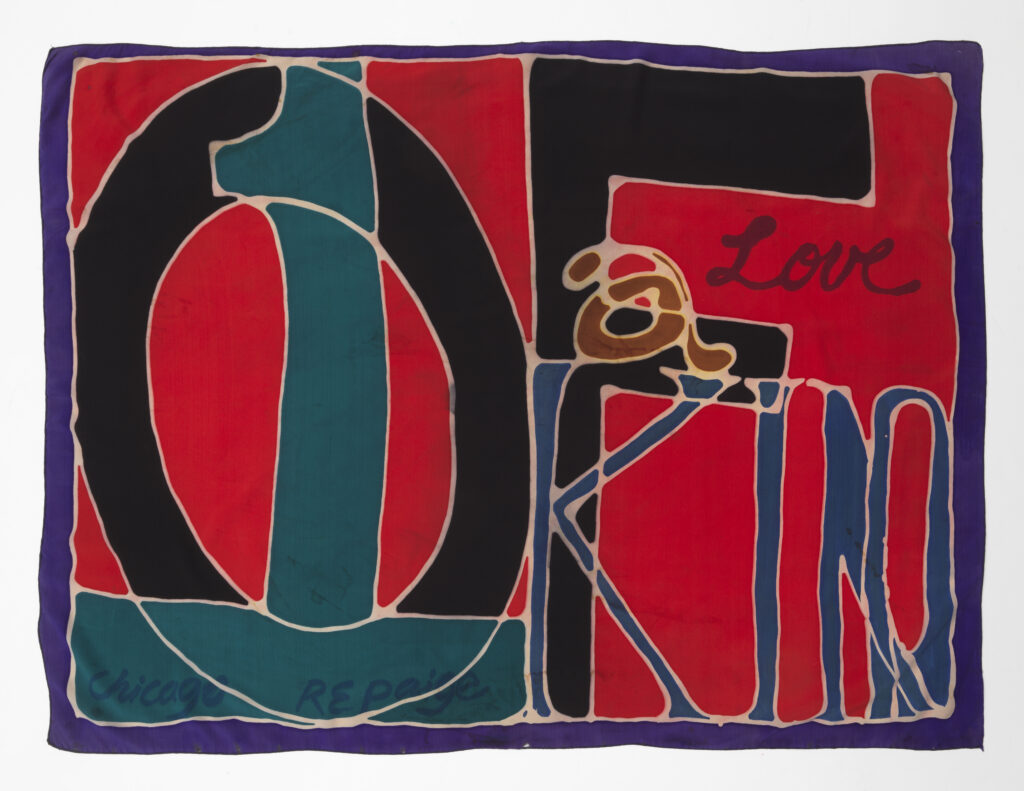 A rectangular scarf with hand-drawn, overlapping text that says "1 of a kind love. Chicago. R E Paige."