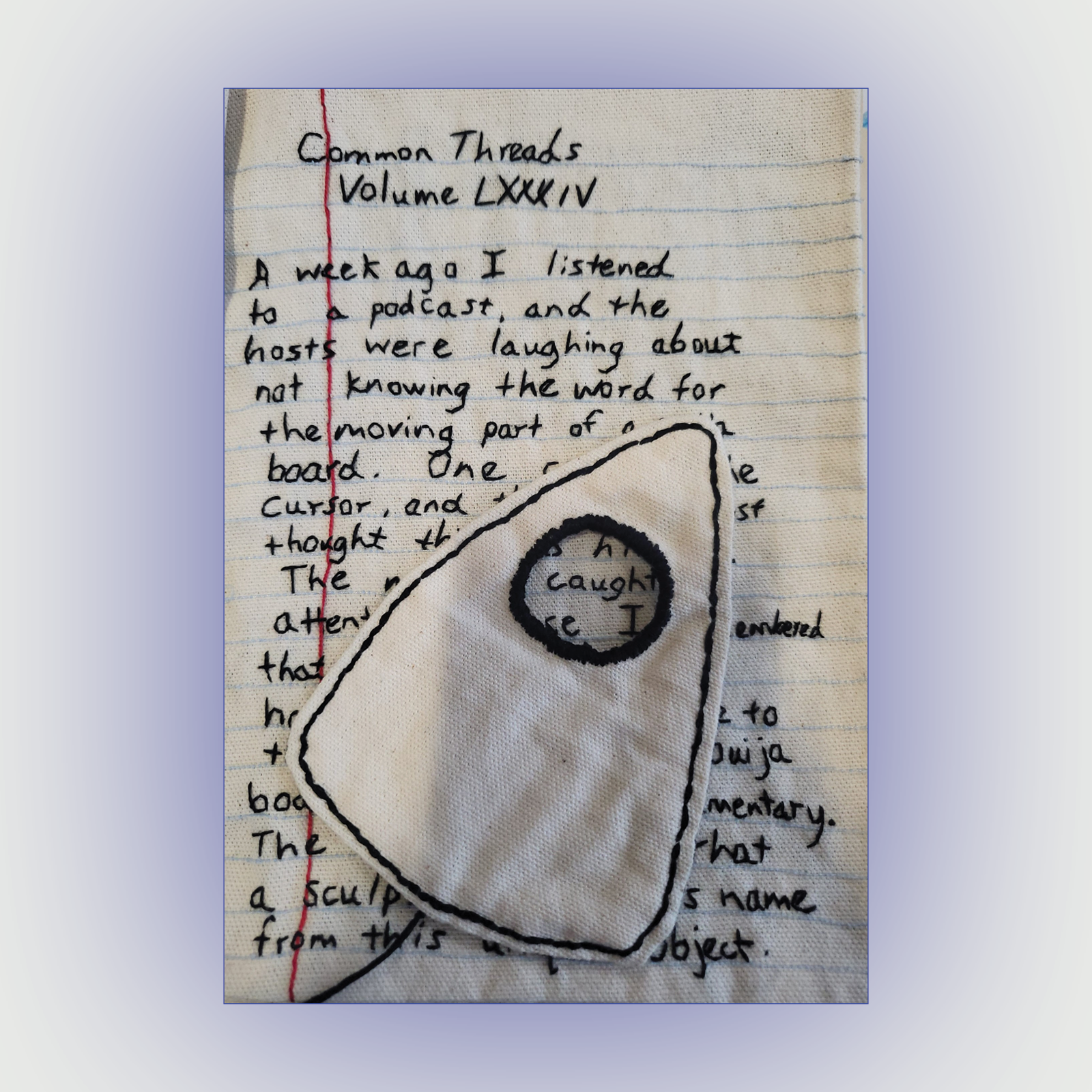 A sheet of lined notebook paper with handwritten notes. The headline says "Common Threads, Volume LXXXIV." The writing is obscured by a triangular piece of fabric with a large hole at the top.