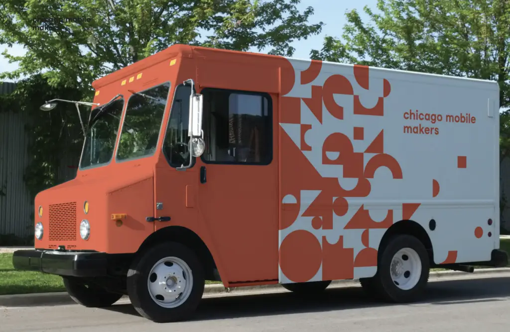 An orange and white former mail truck.